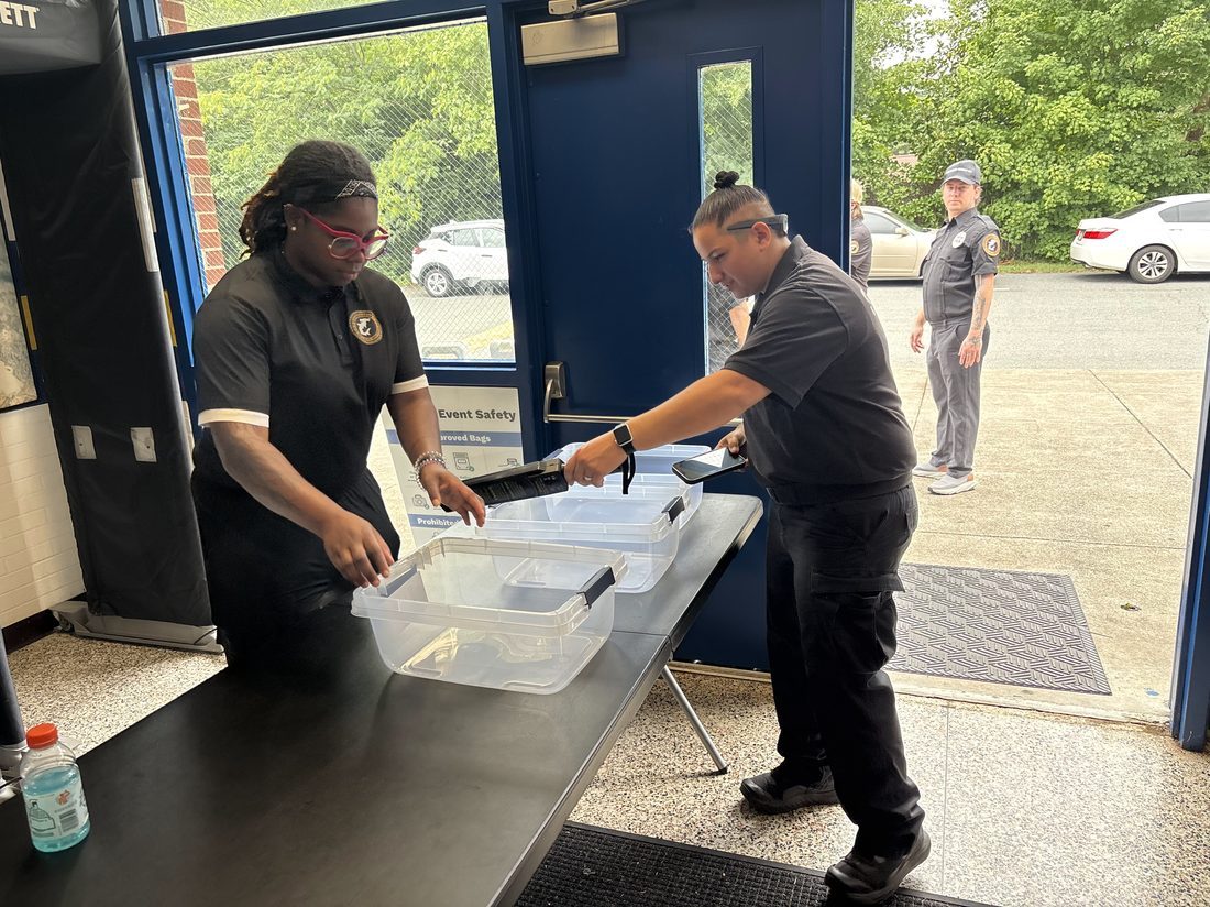 Unarmed Hammerhead Security officers performing entry screening